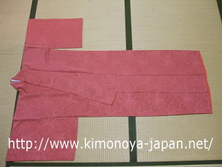 Place the kimono on the floor. The shoulders should be on your left.